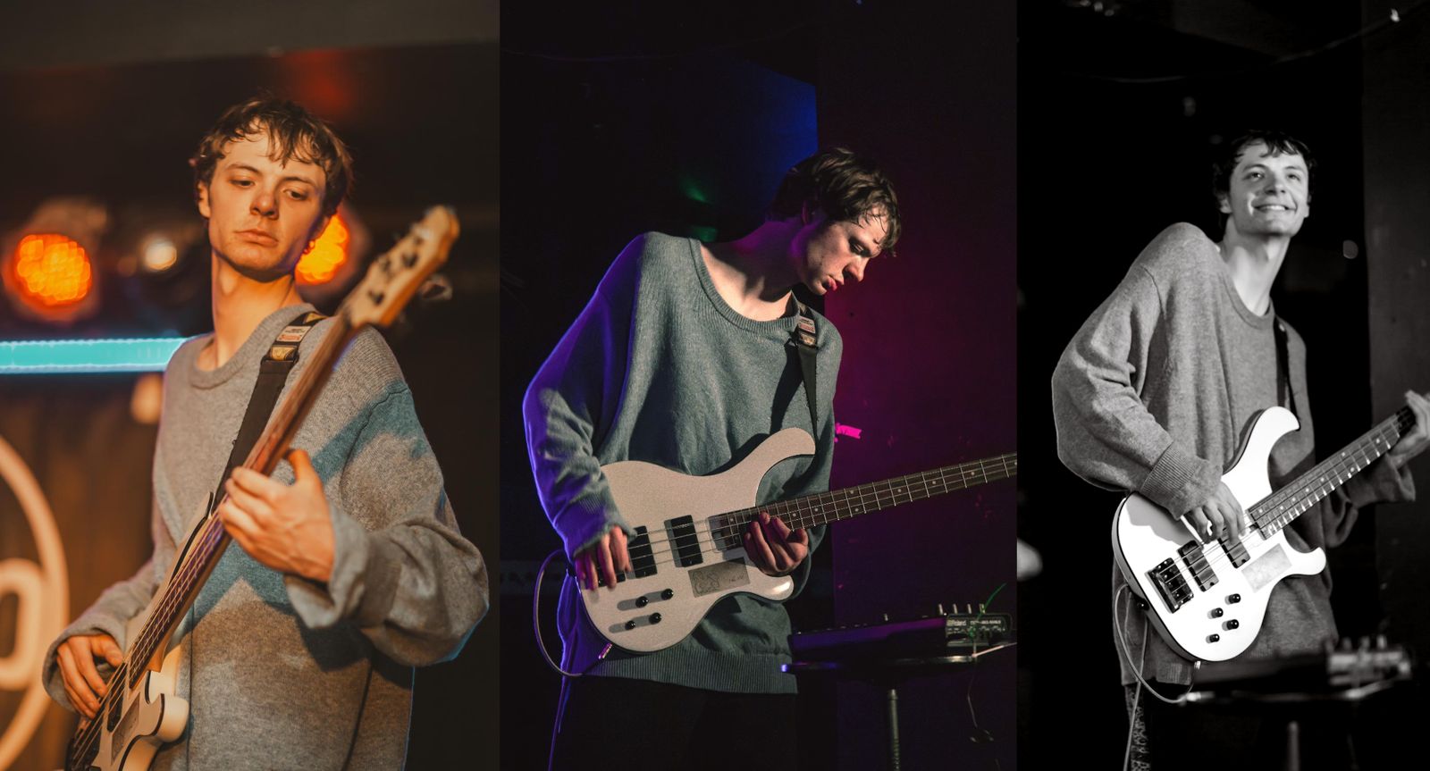 A bassist in a grey jumper playing under green stage light.
